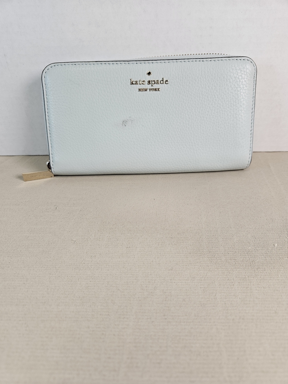 kate spade light blue zip-around pebbled leather wallet